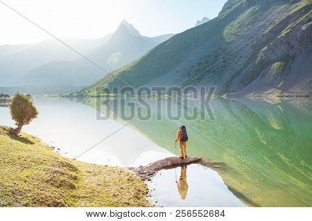 Wanderlust time. Man hiking in beautiful Fann mountains in Pamir, Tajikistan. Central Asia.