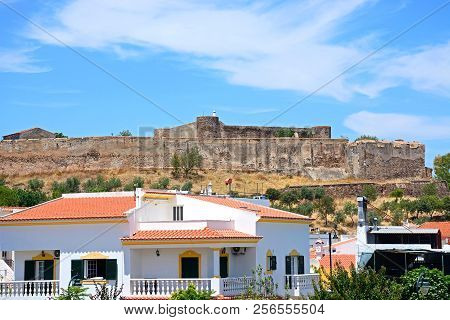Castro Marim, Portugal - June 11, 2017 - View Of The Medieval Castle With Town Buildings In The Fore