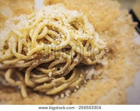 Close Up Of Traditional Italian Cheese And Pepper Tonnarelli Pasta