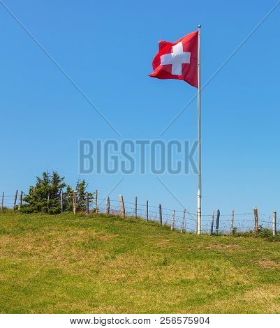 Flag Of Switzerland On Mt. Rigi In Switzerland. The Rigi Is A Popular Tourist Destination, Accessibl