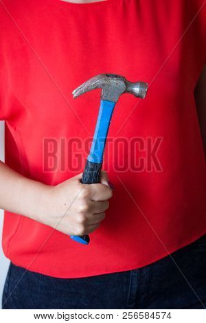 Woman Holding The Hammer In The Hands Ready For Design Work