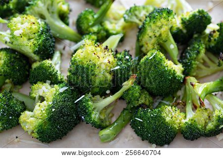 Roasted Broccoli Florets With Cheese On A Baking Tray