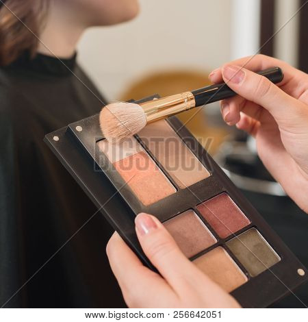 Closeup Of Professionsl Makeup Artist Applying Eyeshadows With Brush