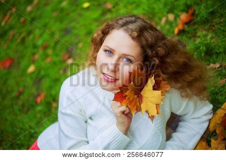 beautiful young plussize model   in the autumn park