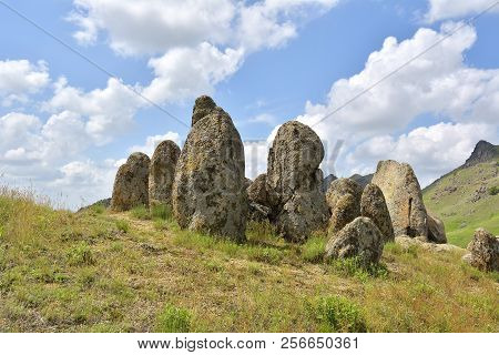 Rocks Formations In Dobrogea, Tulcea County, Romania. Naturally Formed Piles Of Large Rocks In Macin