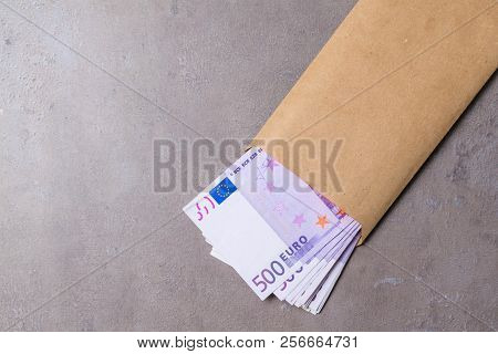 Euro In Beige Envelope, Isolated On A Grey Background