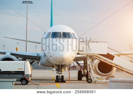 Commercial airplane beying prepared for next flight. Detail of front pilots cabine
