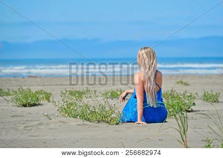 Summer Vacation On Beach. Carefree Woman On Beach Looking At The Sea. Seashore Olympic Peninsula. Ol