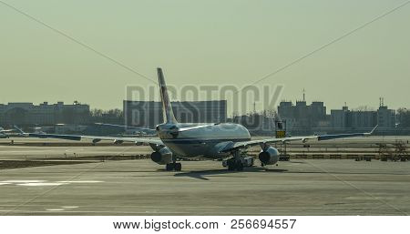 Passenger Airplane Docking At The Airport