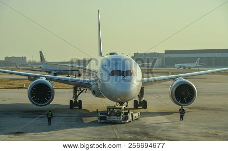 Passenger Airplane Docking At The Airport