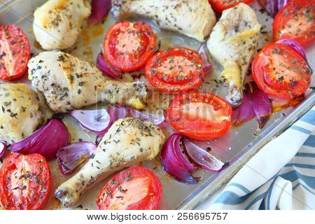 Sheet Pan Dinner Of Chicken, Roma Tomatoes And Red Onions With Dish Towel