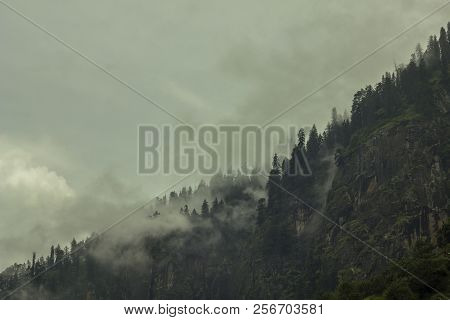 Heavy Cloud And Fog In The Rocks Mountains