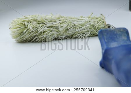 A One Roller For Painting Ready For Using On White Background With Blue Grip. Lets Go