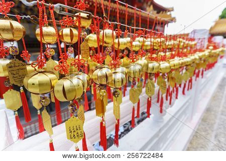 Nantou County , Taiwan - June 1 , 2018 : Devotees Hanging Golden Prayer Bells For Blessing At Sun Mo