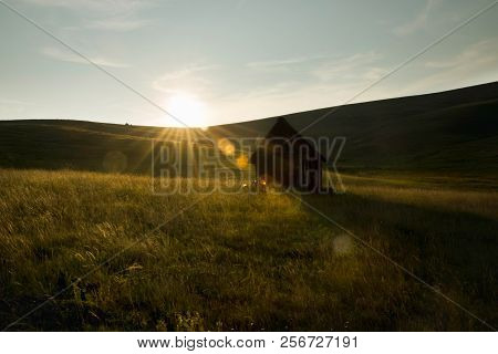 Sunset In Countryside Landscape. Fields And Countryside Landscape. Old Cabin In Meadow Sunset. Natur