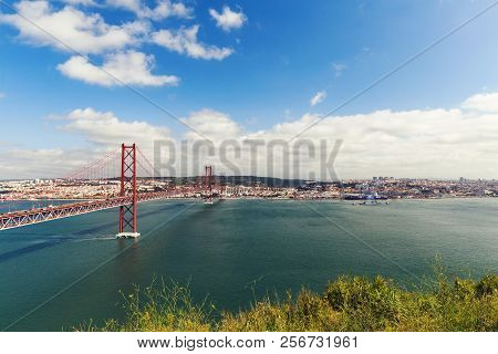 The 25 De Abril Steel Suspention Bridge In Lisbon
