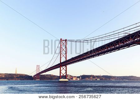 The 25 De Abril Steel Suspention Bridge In Lisbon