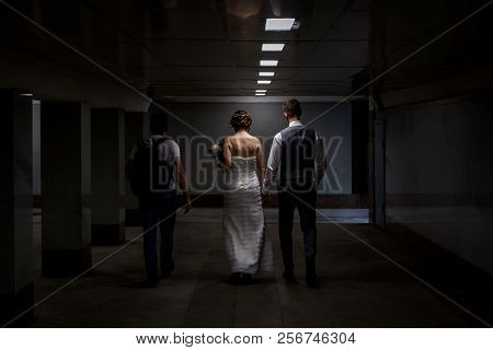 Moscow, Russia, July 14, 2018: Loving Couple Holding Hands And Walking Through The Underpass.