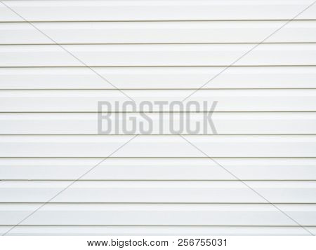 Plastic siding surface in black and white. Abstract background and texture.