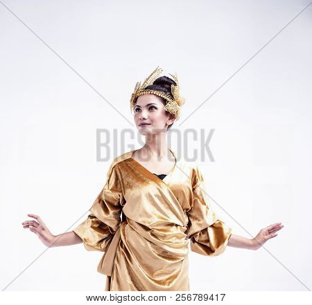 The Beauty Lady Is Wearing Glod Dress ,put Butterfly Crown On Head, Posing On White Background,the F