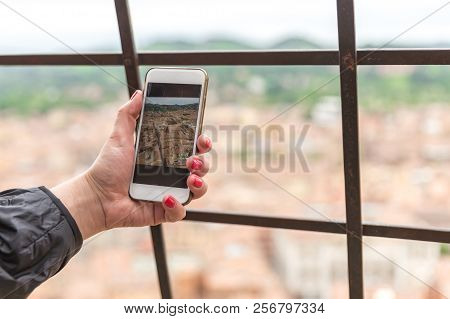 Taking Picture Of Bologna With Cellphone From Top Of Tower