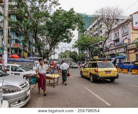 Yangon, Myanmar - Feb 26, 2016. Street Of Yangon, Myanmar. For Many Years, Motorbikes Have Been Bann