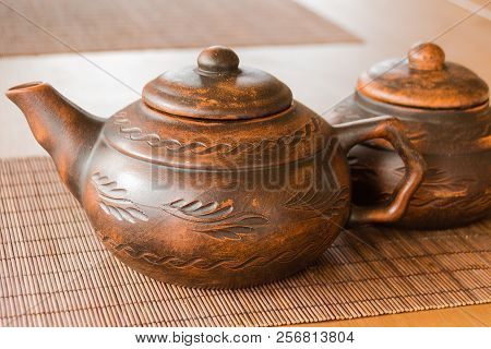 A Beautiful Clay Teapot With An Orienic Pattern. Tea Drinking.