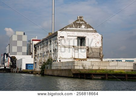 Zaanse Schans, Netherlands, August 19, 2015 - Industrial Area With Old Building, Boat And Crane.