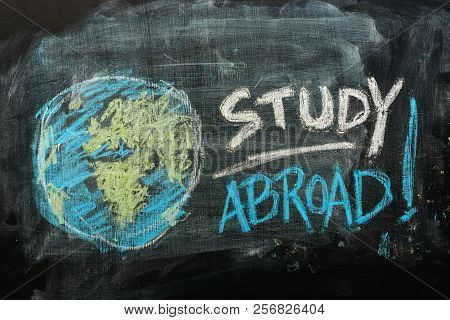 Study Abroad Concept With Handwritten Text In Chalk On School Blackboard