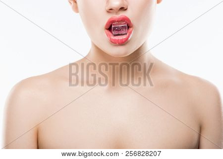 Cropped View Of Naked Woman Holding Ice Cube In Lips, Isolated On White