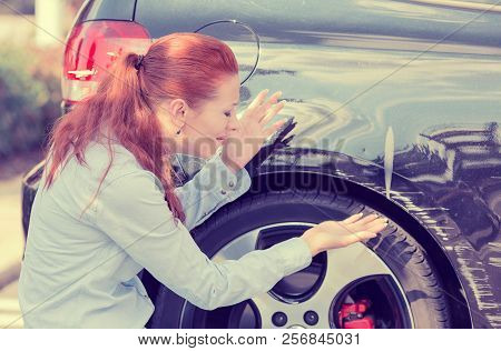 Frustrated Young Woman Checking Pointing At Car Scratches And Dents Outdoors Outside