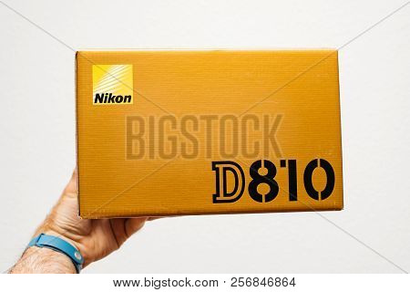 Paris, France - Feb 15, 2018: Man Holding Against White Background A Nikon D810 Dslr Camera Box Befo