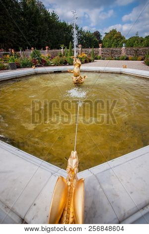 Baroque Fountain In The Garden Or A Royal Palace In The Netherlands. Greek Sculp Hours And Fantasy A