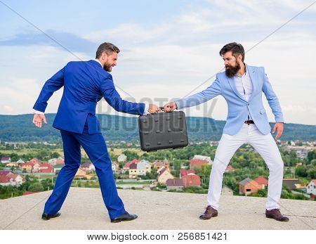Men In Suits Handover Briefcase. Business Deal Landscape Background. Businessman Takes Away Briefcas