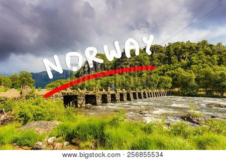 Tourist Woman Standing On Stone Slab Bridge Terland Klopp In Norway Dalane Region.