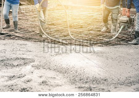Workers Man Using A Vibration Machine For Eliminate Bubbles In Concrete. After Pouring Ready-mixed C
