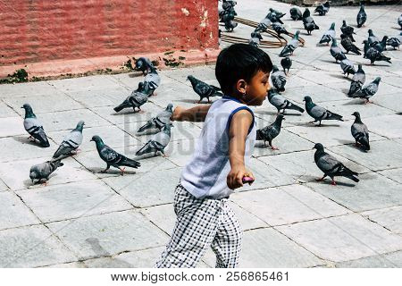 Kathmandu Nepal August 24, 2018 View Of A Nepali Child Playing Around The Shree Gha Stupa Temple Loc