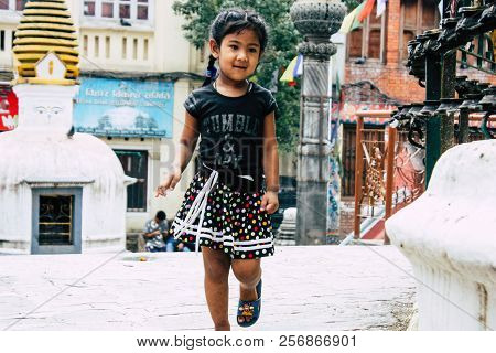 Kathmandu Nepal August 24, 2018 View Of A Nepali Child Playing Around The Shree Gha Stupa Temple Loc
