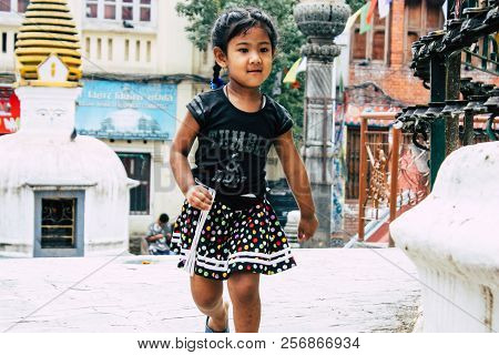 Kathmandu Nepal August 24, 2018 View Of A Nepali Child Playing Around The Shree Gha Stupa Temple Loc
