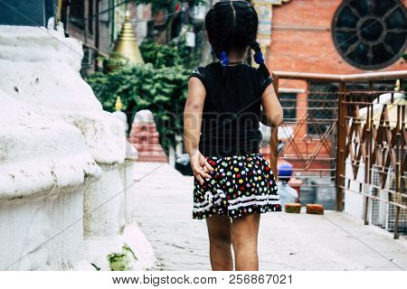 Kathmandu Nepal August 24, 2018 View Of A Nepali Child Playing Around The Shree Gha Stupa Temple Loc
