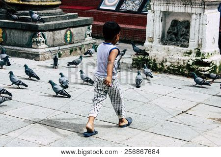 Kathmandu Nepal August 24, 2018 View Of A Nepali Child Playing Around The Shree Gha Stupa Temple Loc
