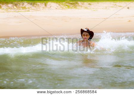 Woman And Hat Happy With Wave On Beach At Bang Beot Beach, Chumphon Province Thailand