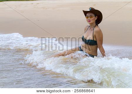 Woman Shape Beautiful With Bikini Relax Wave On Beach At Bang Beot Beach, Chumphon Province Thailand