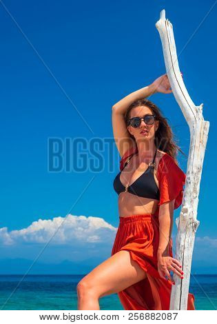 woman sunbathing on the beach summer travel holidays
