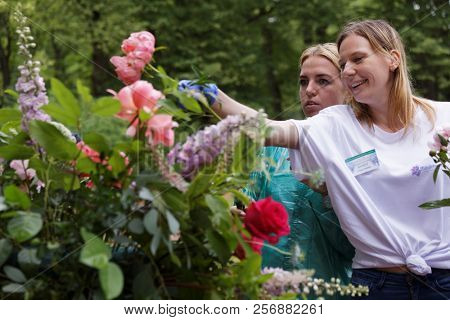ST. PETERSBURG, RUSSIA - JULY 20, 2018: Florists of Mila Schumann Studio Flowers & Design prepare the bouquet for the festival Imperial Bouquet in the park of State Museum Pavlovsk