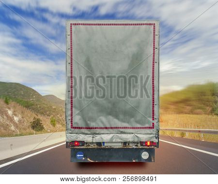 Back View Of Turck Cargo Transport Container On The High Way Road