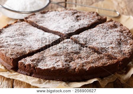 Homemade Swedish Chocolate Sticky Cake Close-up On A Table. Horizontal
