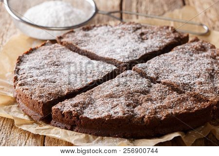 Kladdkaka Chocolate Dessert Pastry With Powdered Sugar Close-up. Horizontal