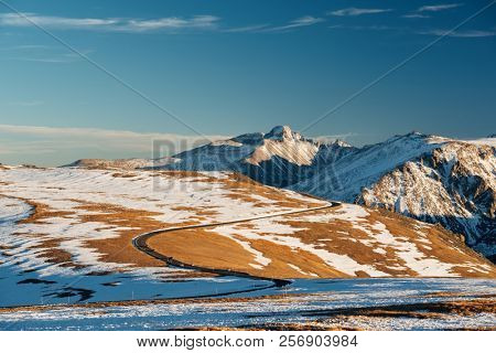 Trail Ridge Road, the highest (12,183 feet) continuous highway in the USA in high alpine tundra with rocks and mountains at autumn. Rocky Mountain National Park in Colorado, USA. 