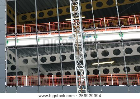 Close Up Detail Of The Construction Site Of A Metal Framed Large Building Development With A Hoist R